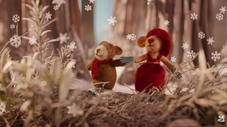 Felt toys walk in the snow during the National Trust's Christmas advert 2025